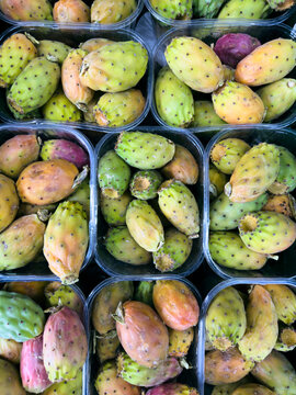 Still life view from above of containers of fresh prickly pears
