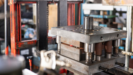 Metal Press Die Loaded on a Hand Lift in a Factory Workshop