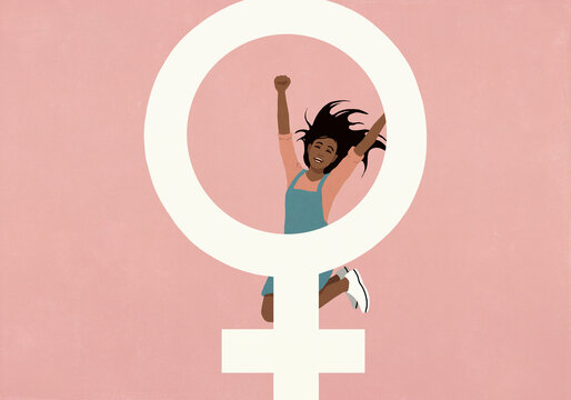 Carefree woman jumping for joy behind female symbol against pink background
