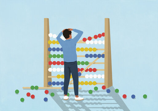 Surprised man watching beads fall from large, broken abacus
