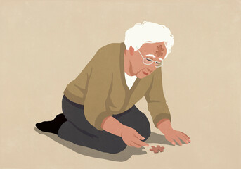 Senior man with jigsaw indent in forehead reaching for puzzle piece on ground
