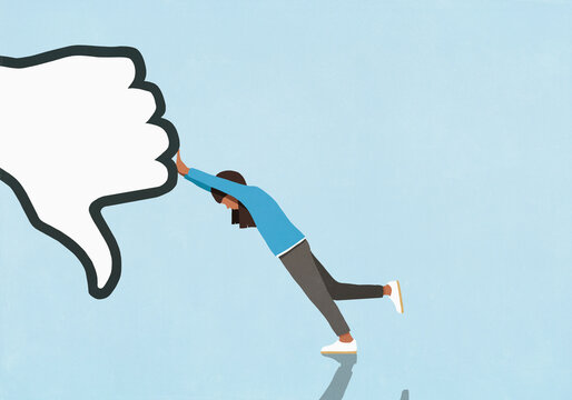 Woman resisting, pushing thumbs-down symbol on blue background
