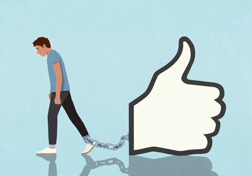Social media thumbs up like button icon shackled to ankle of dejected man against blue background
