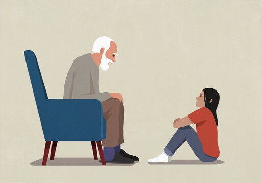 Senior grandfather talking face to face with granddaughter
