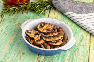 Tasty hot grilled champignon mushrooms