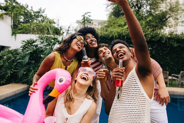 Friends at pool party taking selfie