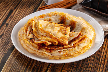 Thin homemade golden pancaces stack