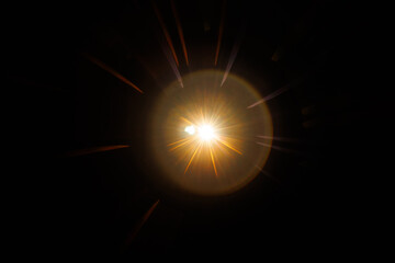 Lens Flare. Light over black background. Easy to add overlay or screen filter over photos. Abstract sun burst with digital lens flare background. Gleams rounded and hexagonal shapes, rainbow halo.