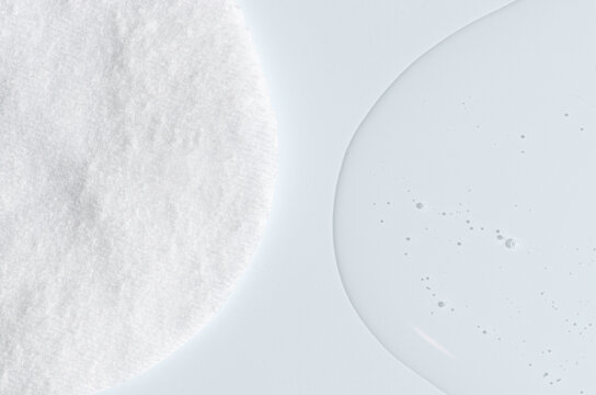 A cotton pad for removing makeup and micellar water.