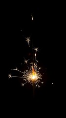 Obraz premium Sparkler glowing in the dark a festive light perfect for celebrations and special events