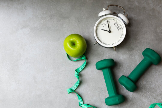 New Year for New Changes Healthy 2026.  Fresh vegetable fruits and healthy food for sport equipment for women diet slimming weight loss.  Healthy and Holiday Concept