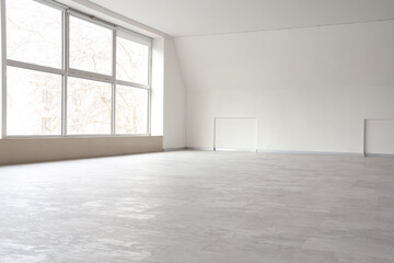 View of big empty room with large window