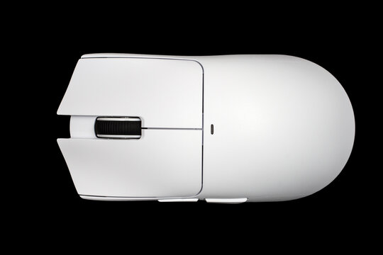 A white computer mouse on a black background. Close-up of a modern computer mouse
