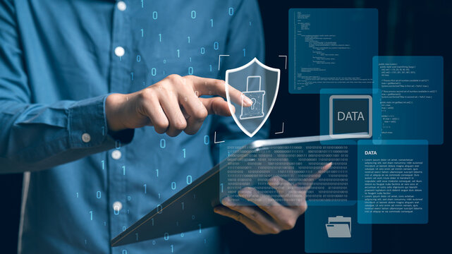 Hand touching a shield lock on a digital panel, encrypted access, data protection and cybersecurity control for modern business systems and IT networks.