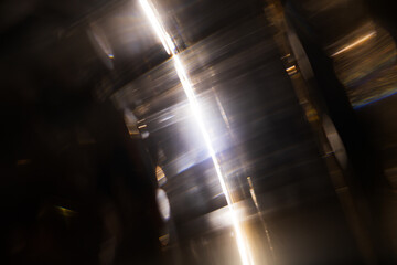 Lens Flare. Light over black background. Easy to add overlay or screen filter over photos. Abstract sun burst with digital lens flare background. Gleams rounded and hexagonal shapes.