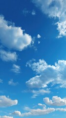 Obraz premium Vibrant blue sky with puffy white clouds natural background and copy space