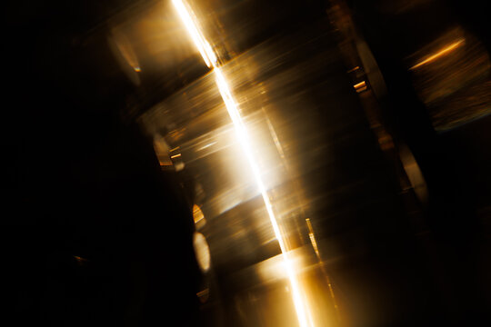 Lens Flare. Light over black background. Easy to add overlay or screen filter over photos. Abstract sun burst with digital lens flare background. Gleams rounded and hexagonal shapes.
