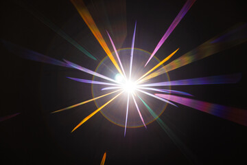 Lens Flare. Light over black background. Easy to add overlay or screen filter over photos. Abstract...