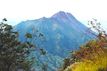 Majestic Volcanic Mountain Over Green Valley at Sunrise