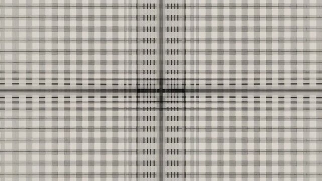 Moving frames showing black-white grid shifting tone and subpixel shift in macro with central cross