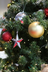 Christmas tree decorated with ornaments and festive lights for the holidays © Thanakrit