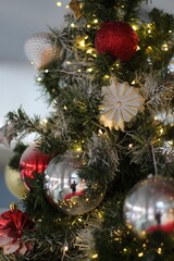 Christmas tree decorated with ornaments and lights, holiday season celebration