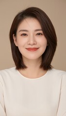 Fototapeta premium portrait of 30 years old asian woman on beige background 