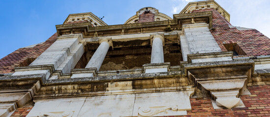 The building has a lot of white and red bricks