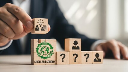 Businessman carefully places a wooden block with people icons on a rising staircase of blocks symbolizing career growth and human resource management strategy