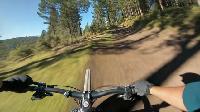 Riding rider in green sleeves and gloves navigating downhill trail holding bars past white tape