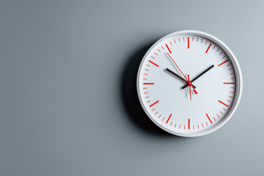 Time is ticking! Modern clock on a gray wall, perfect for business deadlines, efficiency, and time management concepts, adding a sense of urgency and importance