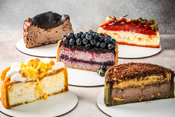Assorted cheesecake slices with colorful toppings