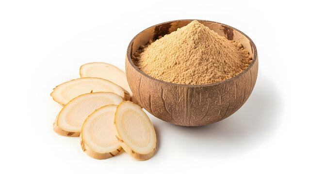 Maca root powder in a wooden bowl with sliced maca root on the side.