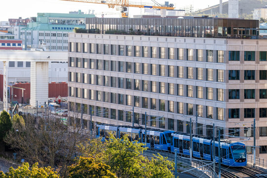 Wide view of modern infrastructure in Stockholm Sweden where a tram highlights urban mobility, advanced transport solutions, strong city network links and dependable public transit