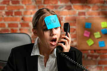 Surprised Businesswoman With Sticky Note on Forehead