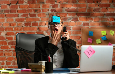 Surprised Businesswoman With Sticky Note on Forehead