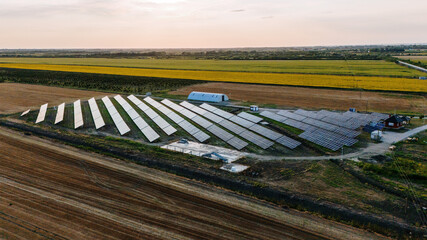 Aerial view of solar panels gleaming under the open sky against the backdrop of golden fields, capturing the contrast of technology and nature, Belgrade, City of Belgrade, Serbia.