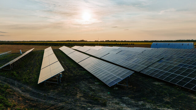 Aerial view of solar panels, basking under the golden light, stretch across the landscape, promising a sustainable future, Belgrade, City of Belgrade, Serbia.