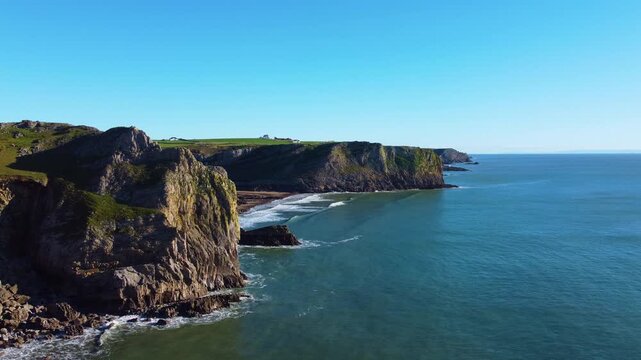 Sideways Aerial Across Dramatic Coastline in South Wales, UK. Drone Clip of Gower Peninsula.