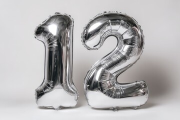 Reflective metallic balloons shaped into the digits 1 and 2 on a white studio backdrop