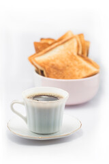Breakfast with coffee and toast on white background