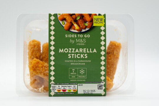 Irvine, Scotland, UK - November 27, 2025: M&S branded Mozzarella sticks in recyclable packaging displaying Art Graphics, Air Fryer symbols and energy Kcal information relative to the product.