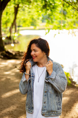 Woman enjoying peaceful moment in public park. Pensive woman. Candid moment. Feelings of tranquility mindfulness and connection with nature.