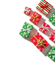 Fototapeta premium Vibrant holiday gifts scattered diagonally on bright white background space