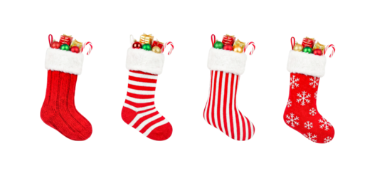 Set of four Christmas stockings filled with gifts isolated on white
