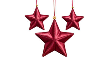 Red Christmas star ornaments hanging isolated on white
