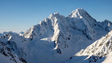 Sunlit Alpine Peaks: Jagged Snow-Covered Mountains Under a Crisp Blue Winter Sky Dramatic Shadows.
