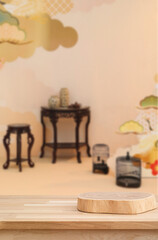 Obraz premium Elegant Display: Captivating composition of vintage furniture, decorative birdcage, and decorative vases set against a soft, ornate backdrop. Evoking a sense of serenity.