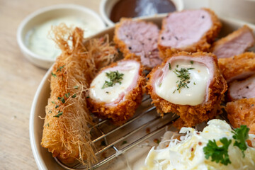 Sous vide pork katsu. Tonkatsu including loin, cheese katsu, and fried shrimp. Fried Pork serve on plate in restaurant