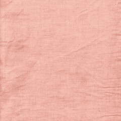 Peach-colored fabric texture with visible cotton folds, perfect for soft backgrounds, textile design, and natural craft visuals.